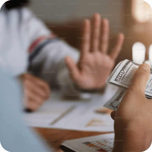 Hand refusing money — our core value